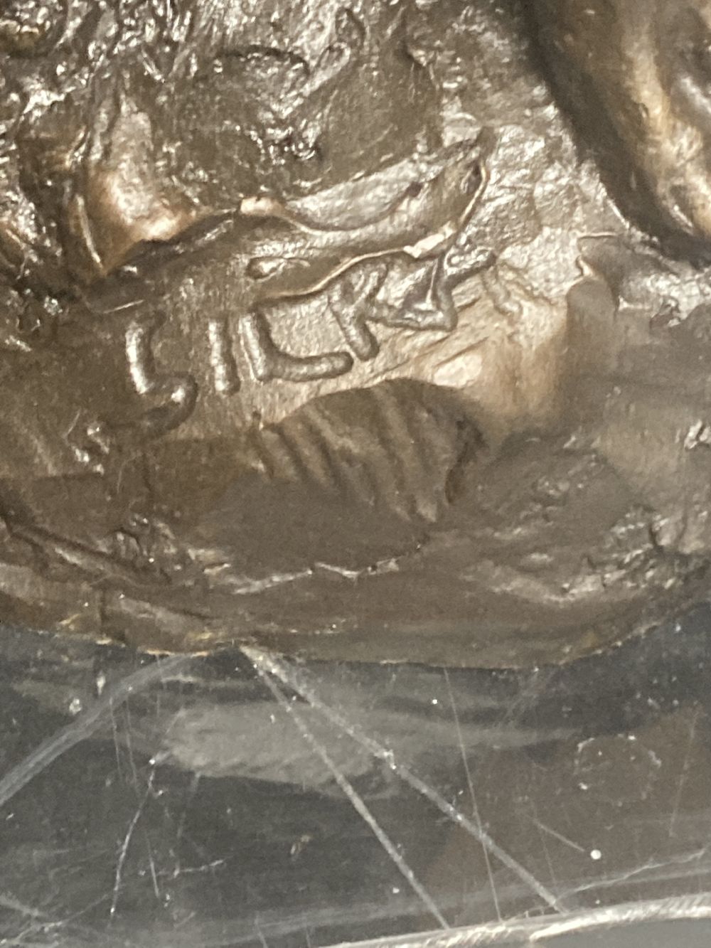 A bronze model of a seated female nude, indistinctly signed Silk, on marble plinth, 52cm